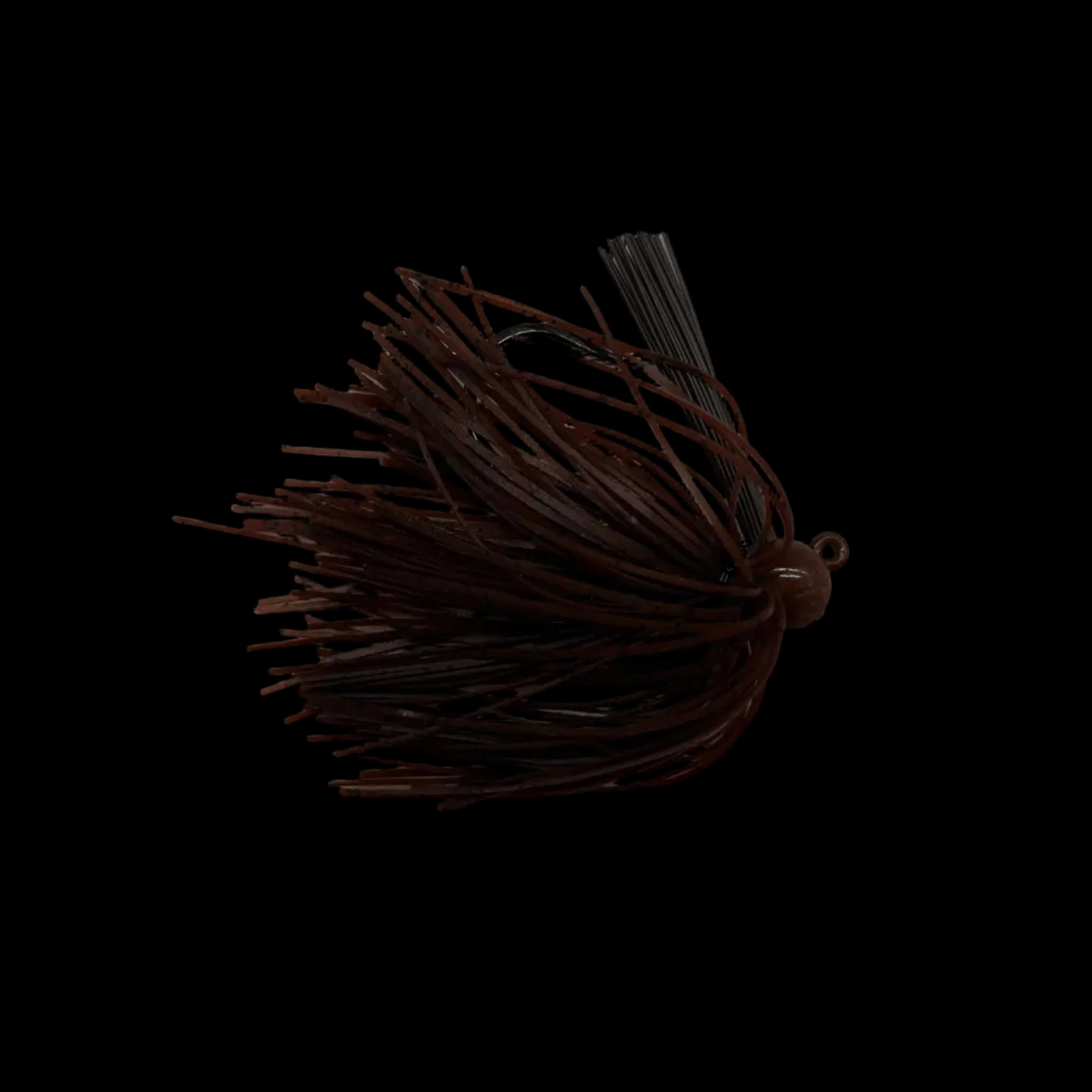 A dark brown soft plastic fishing lure with a single hook and skirt, placed on a light gray marble-patterned surface.